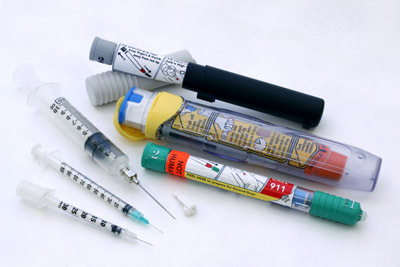 Image of needles, syringes, and auto-injectors